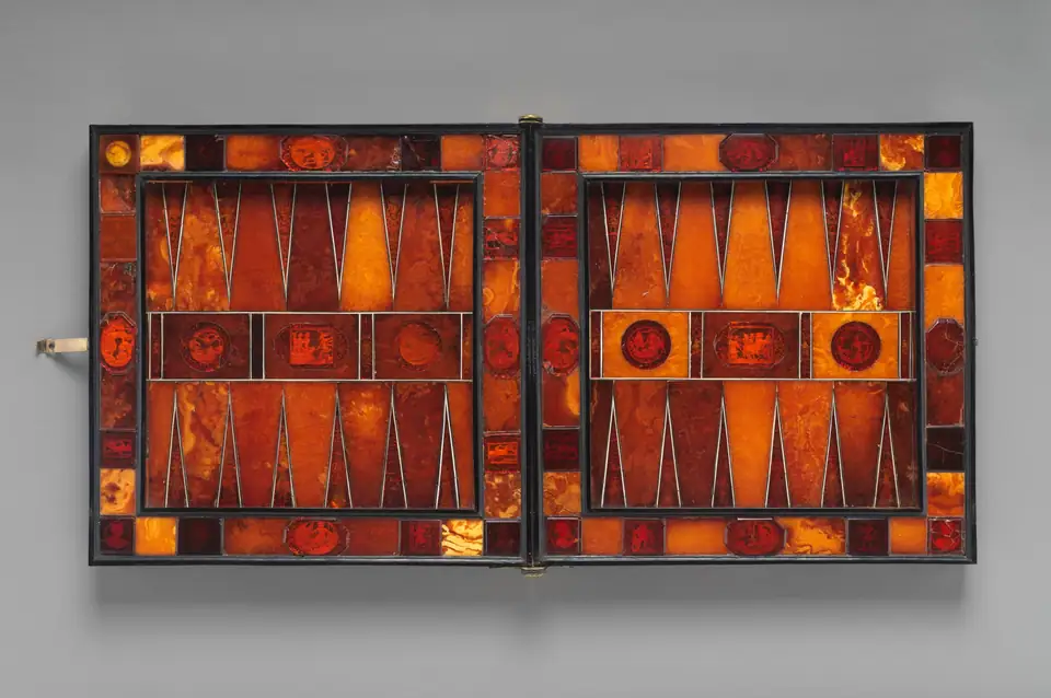 Seventeenth-century folding game board with backgammon points inlaid in amber and wood